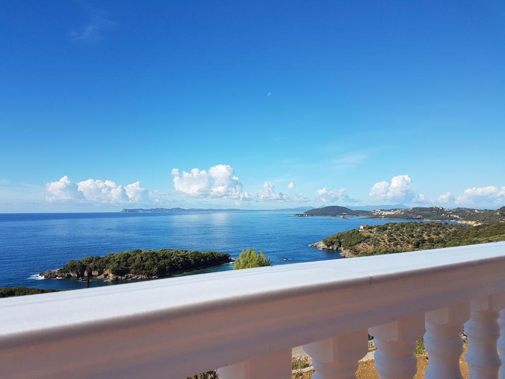 a view of the ocean from a balcony at Syvota Sunset Apartments in Perdika