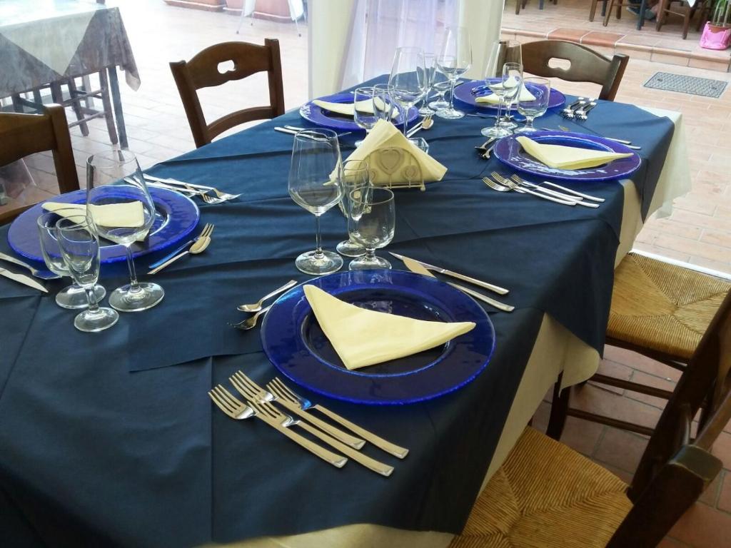 Reštaurácia alebo iné gastronomické zariadenie v ubytovaní Andrea Case Vacanze L'Ancora