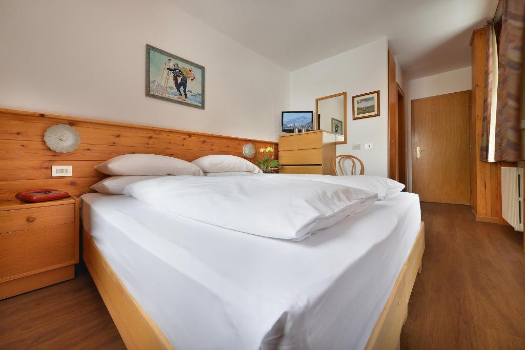 Postel nebo postele na pokoji v ubytování Hotel Livigno