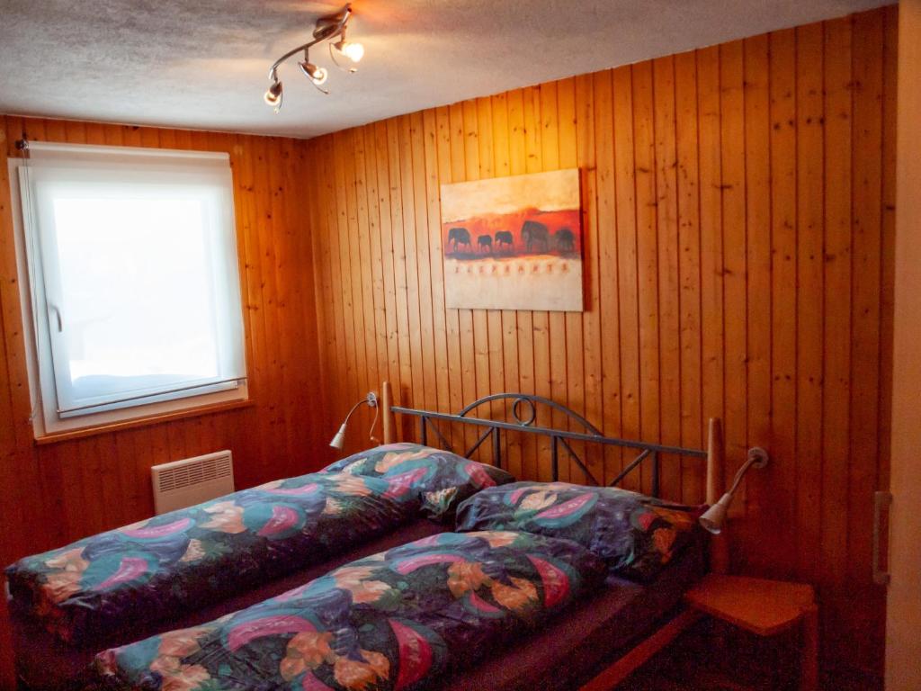 Postel nebo postele na pokoji v ubytování Chalet Fletschhorn