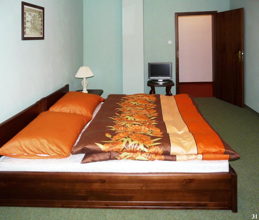 Łóżko lub łóżka w pokoju w obiekcie Resort Maják