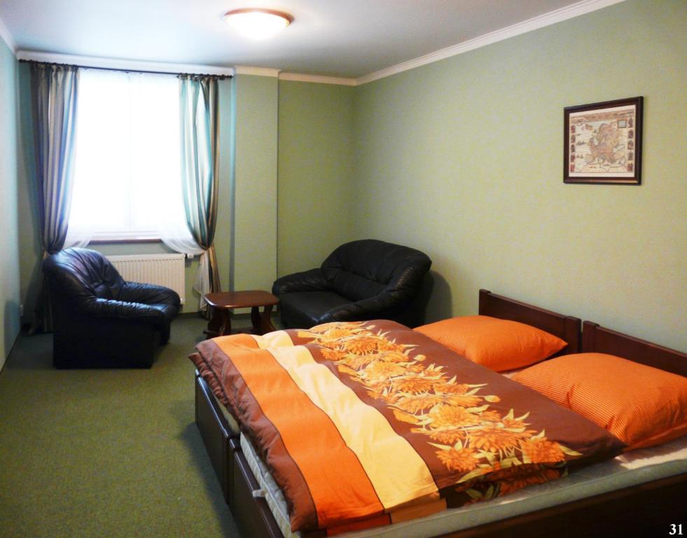 Łóżko lub łóżka w pokoju w obiekcie Resort Maják