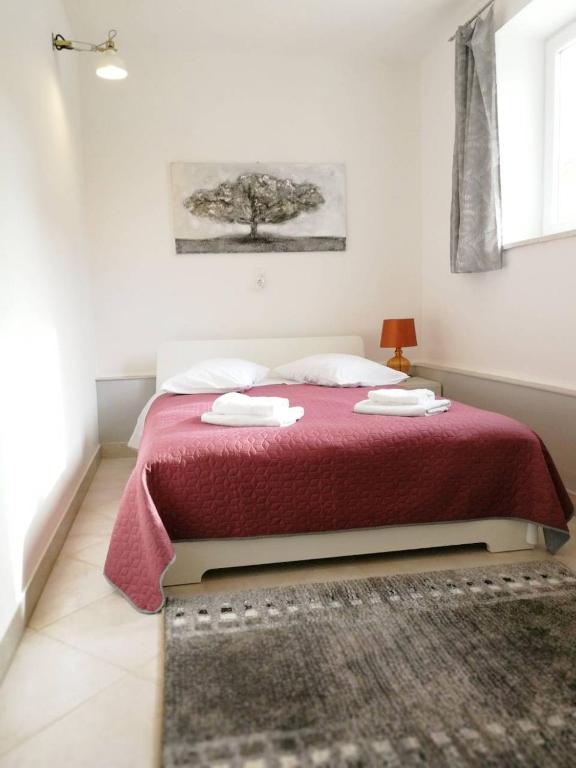 Postel nebo postele na pokoji v ubytování Apartman Unka