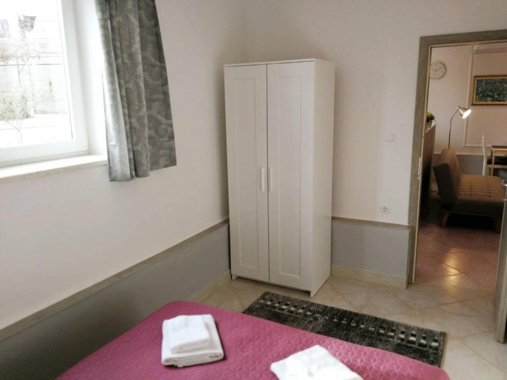 Postel nebo postele na pokoji v ubytování Apartman Unka