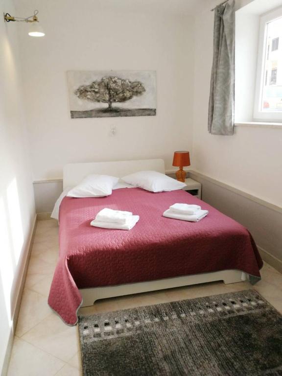 Postel nebo postele na pokoji v ubytování Apartman Unka