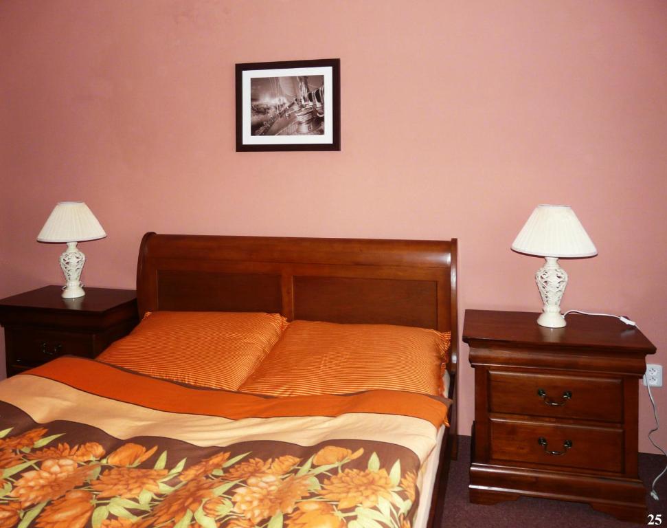 Łóżko lub łóżka w pokoju w obiekcie Resort Maják