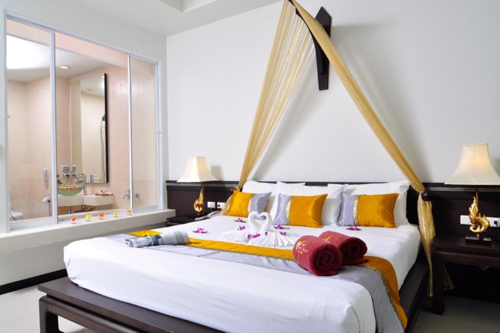 Postel nebo postele na pokoji v ubytování Baan Karonburi Resort