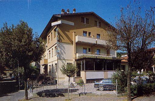 two people sitting on top of a building at Hotel Pierina in Castrocaro Terme