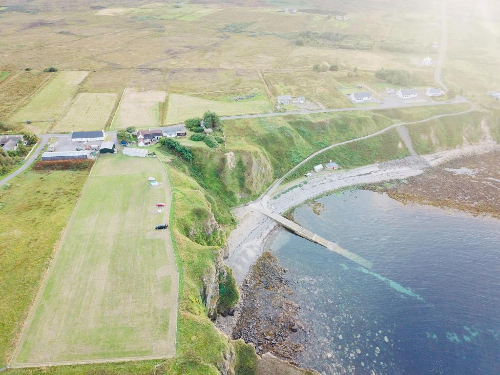 an aerial view of a bridge over a body of water at Windhaven Camping and B&B in Thurso