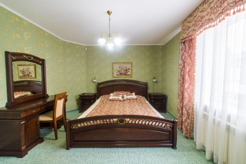 Postel nebo postele na pokoji v ubytování Hotel Premyer