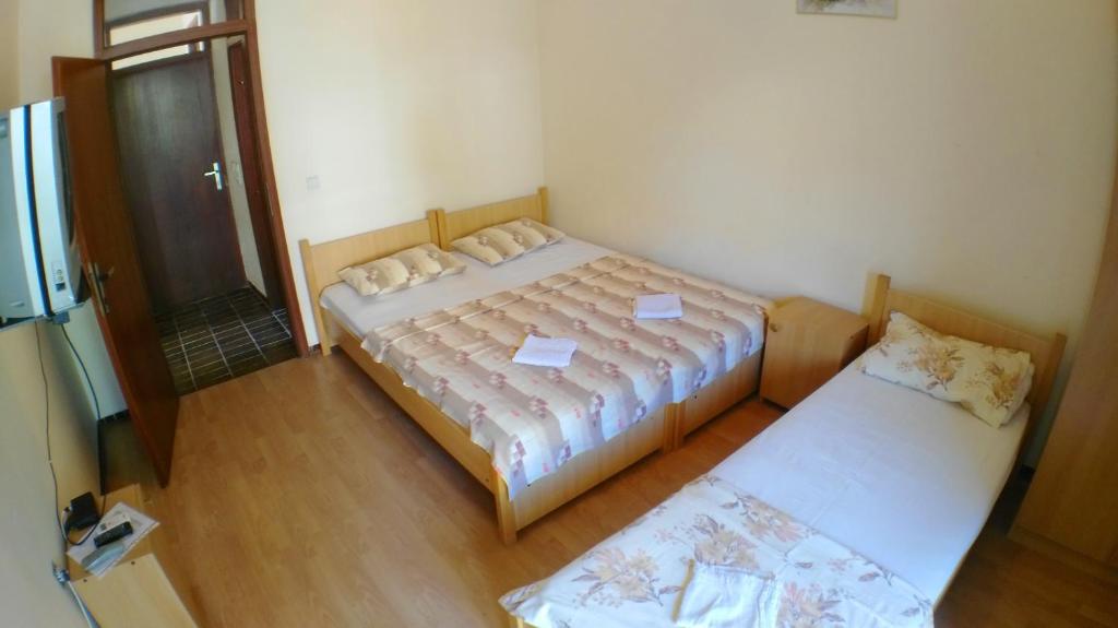 Postel nebo postele na pokoji v ubytování Guesthouse Obala