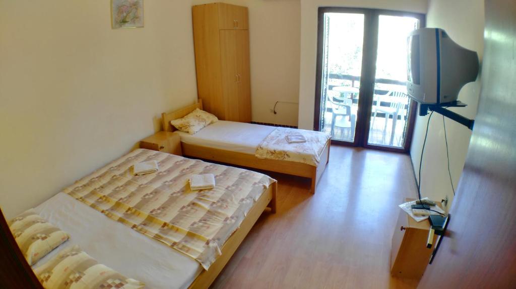 Postel nebo postele na pokoji v ubytování Guesthouse Obala