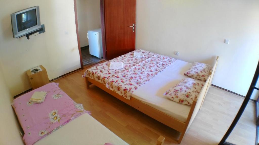 Postel nebo postele na pokoji v ubytování Guesthouse Obala
