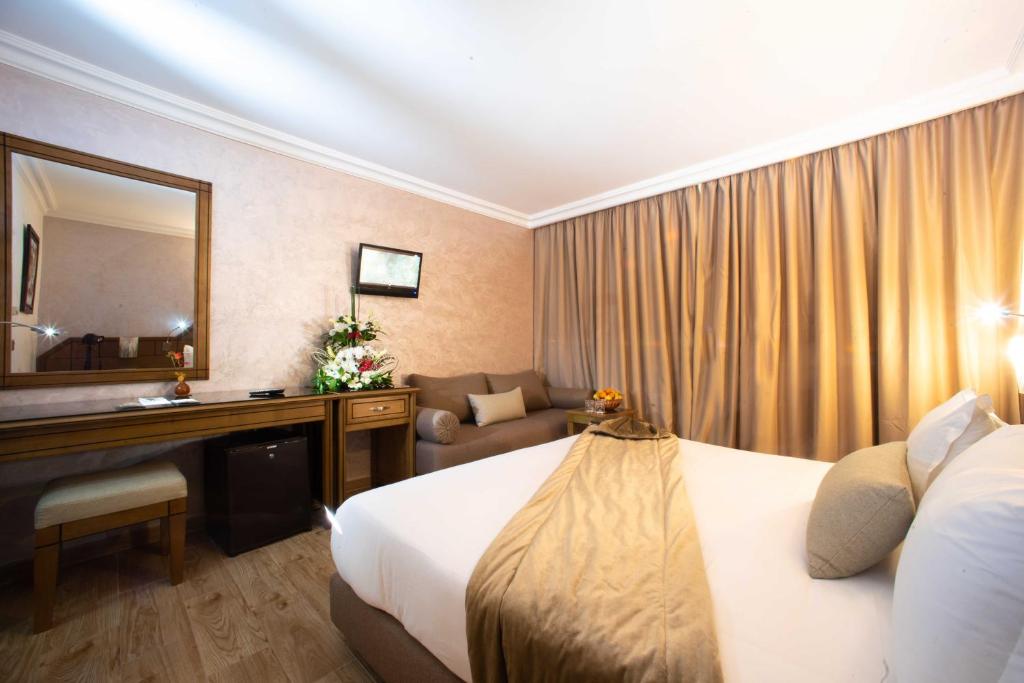 Rúm í herbergi á Hotel Argana Agadir