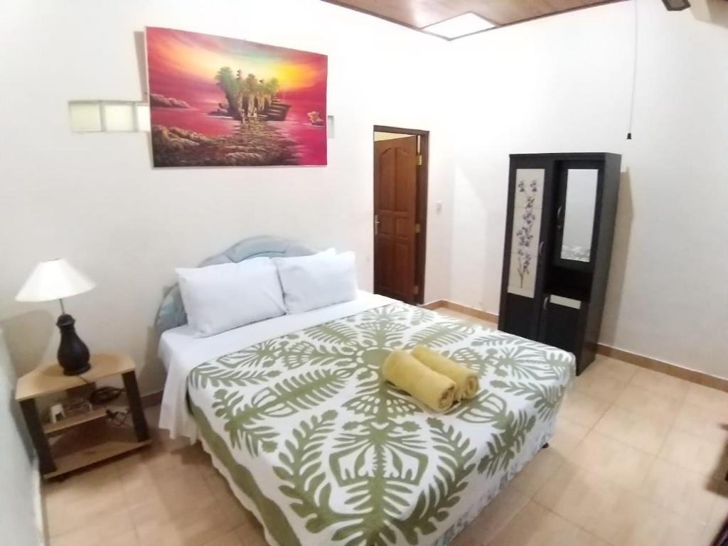 Postel nebo postele na pokoji v ubytování Muka House