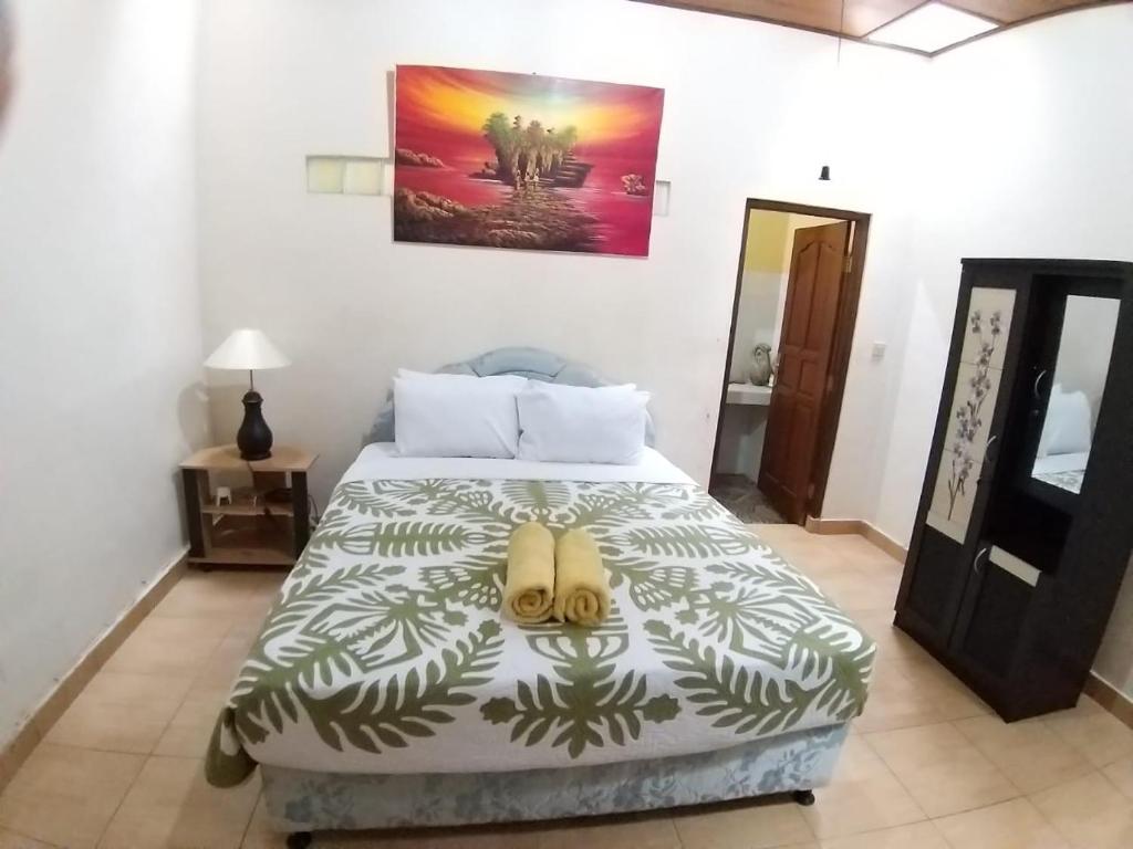 Postel nebo postele na pokoji v ubytování Muka House