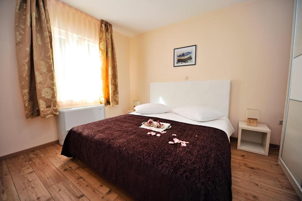 Postel nebo postele na pokoji v ubytování Lastura Aparthotel