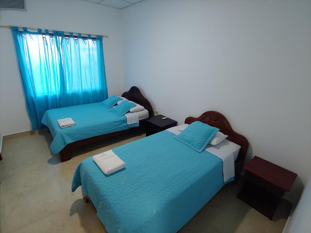 Postel nebo postele na pokoji v ubytování Hostal Punta Arena