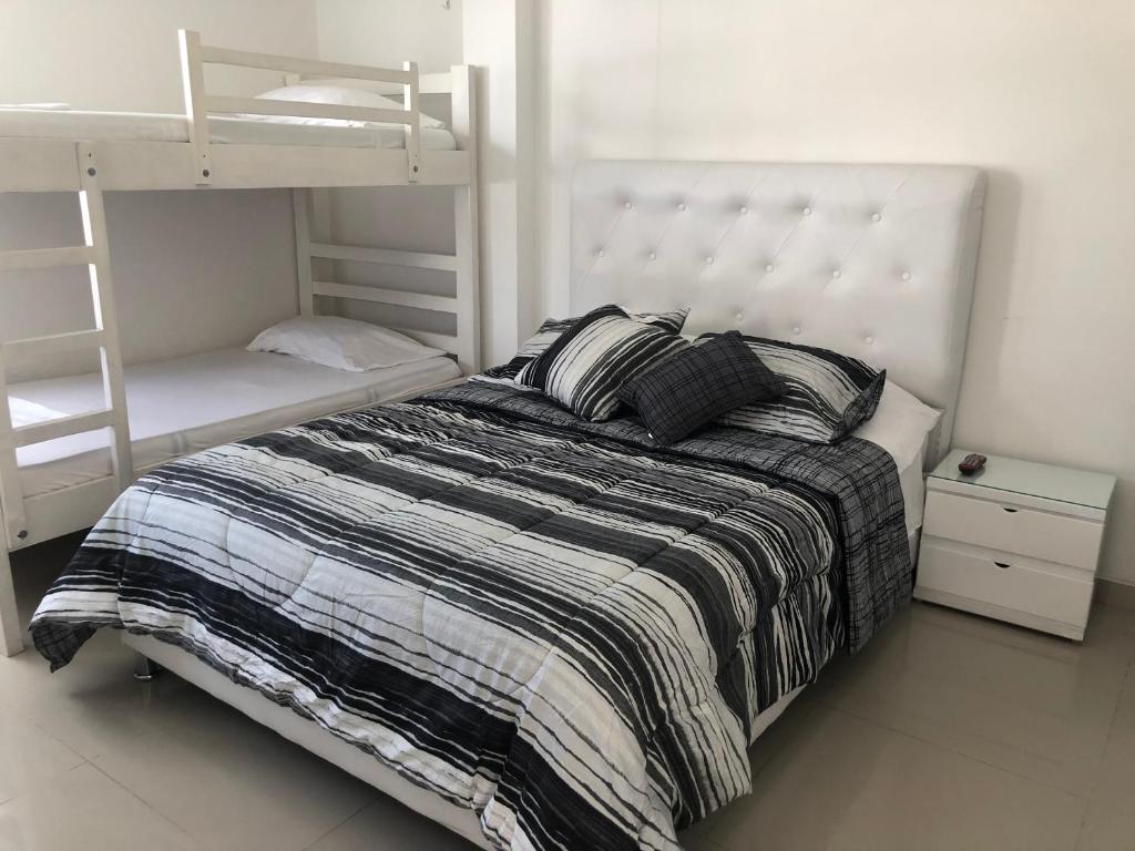 Postel nebo postele na pokoji v ubytování Sashii Hostel & Boutique.