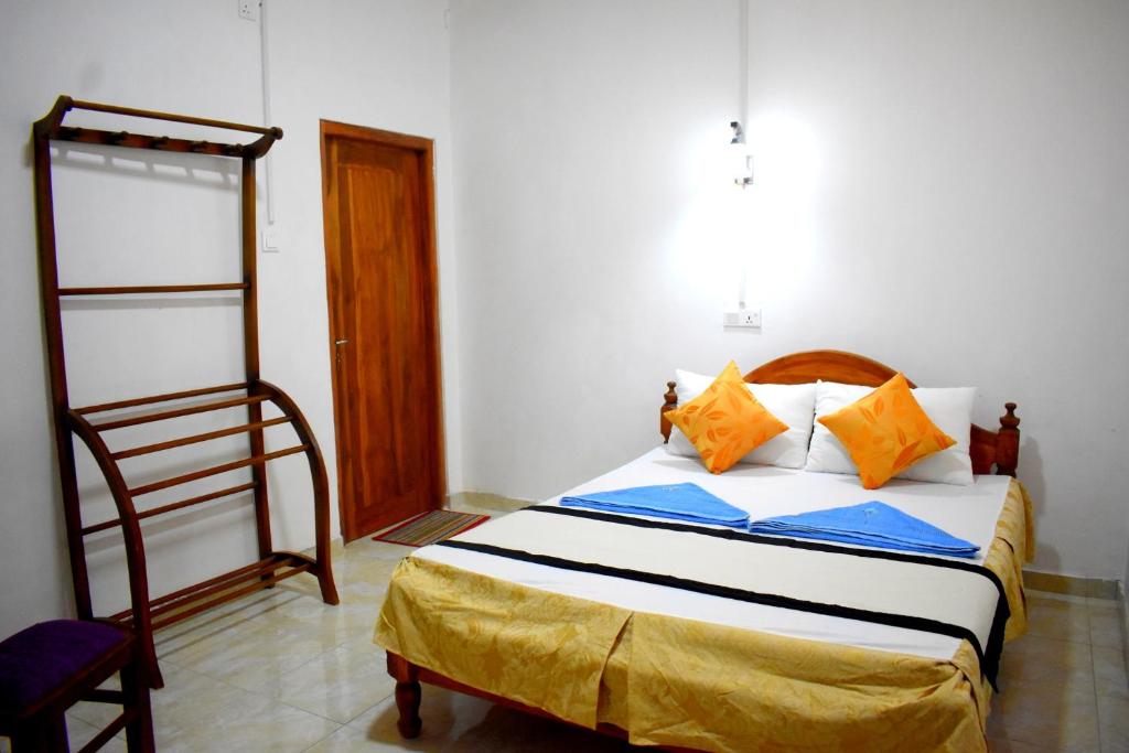 Postel nebo postele na pokoji v ubytování KAUSHIKA RESORT