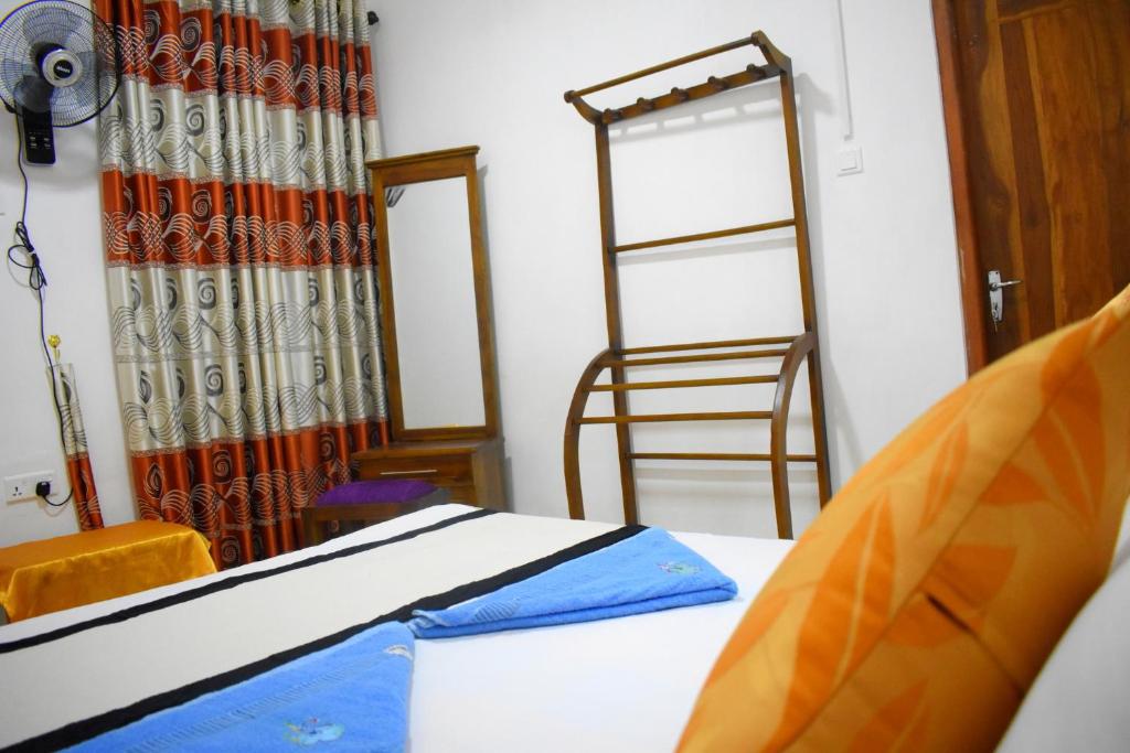 Postel nebo postele na pokoji v ubytování KAUSHIKA RESORT