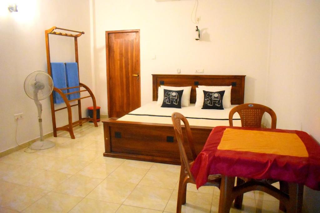 Postel nebo postele na pokoji v ubytování KAUSHIKA RESORT