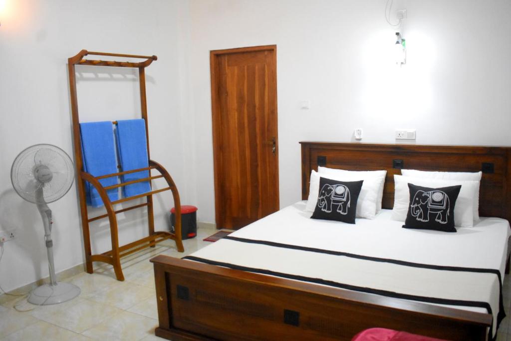 Postel nebo postele na pokoji v ubytování KAUSHIKA RESORT