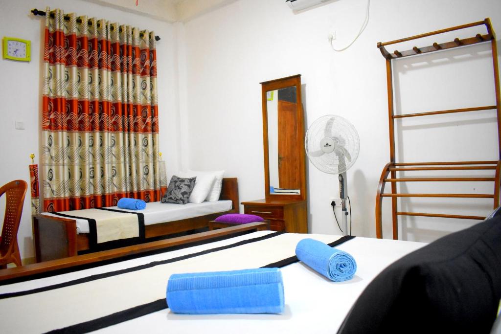Postel nebo postele na pokoji v ubytování KAUSHIKA RESORT
