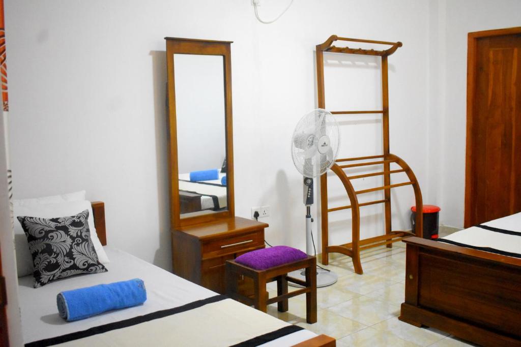 Postel nebo postele na pokoji v ubytování KAUSHIKA RESORT