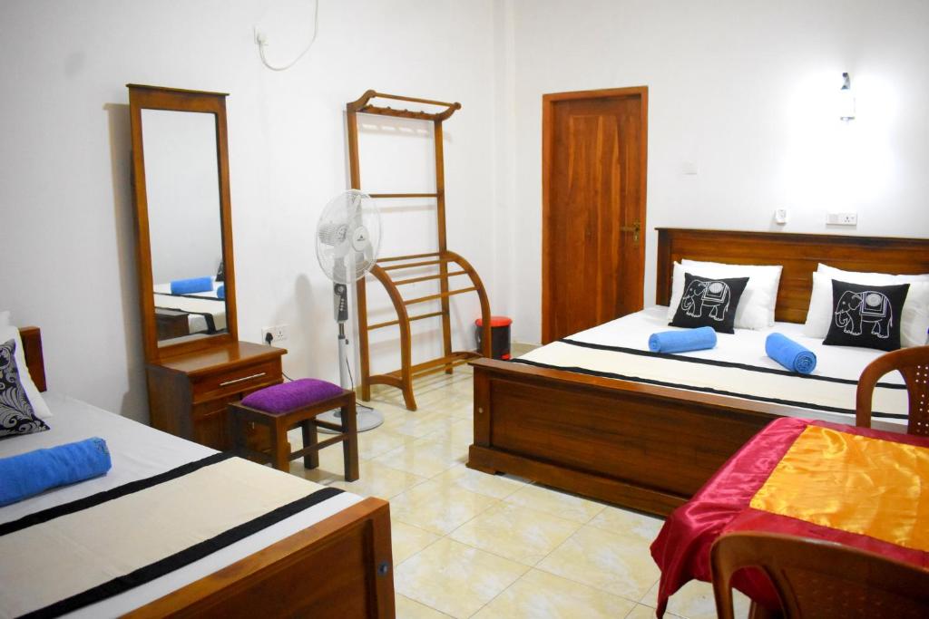 Postel nebo postele na pokoji v ubytování KAUSHIKA RESORT