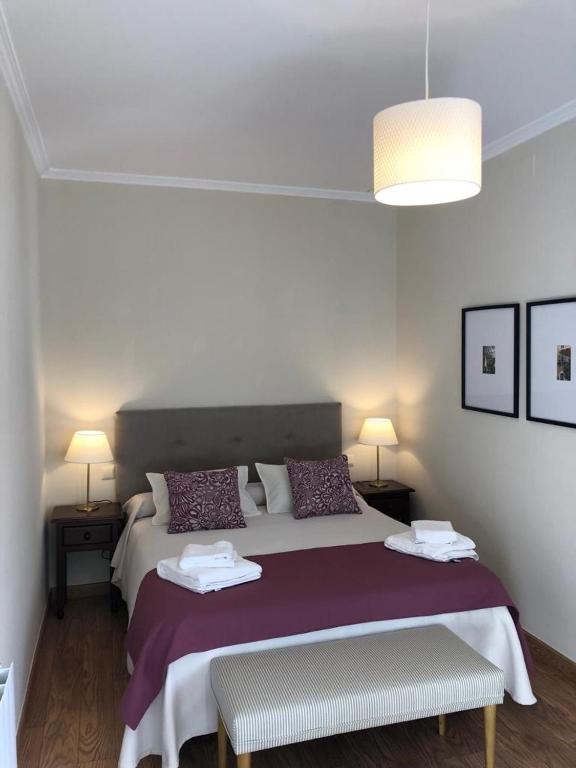 Postel nebo postele na pokoji v ubytování Hotel La Muralla