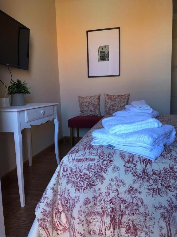 Postel nebo postele na pokoji v ubytování Hotel La Muralla