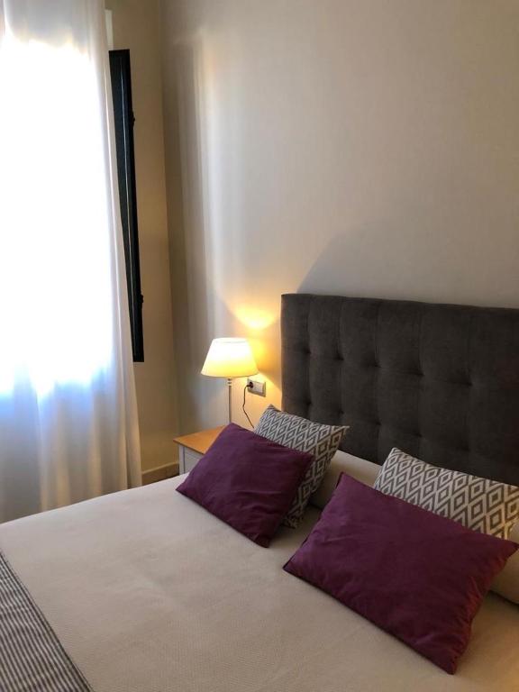 Postel nebo postele na pokoji v ubytování Hotel La Muralla