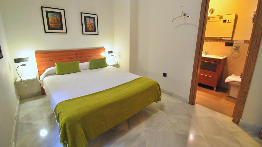 Posteľ alebo postele v izbe v ubytovaní Living-Sevilla Apartments San Lorenzo