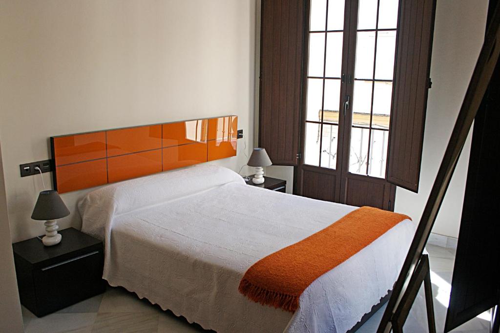 Posteľ alebo postele v izbe v ubytovaní Living-Sevilla Apartments San Lorenzo