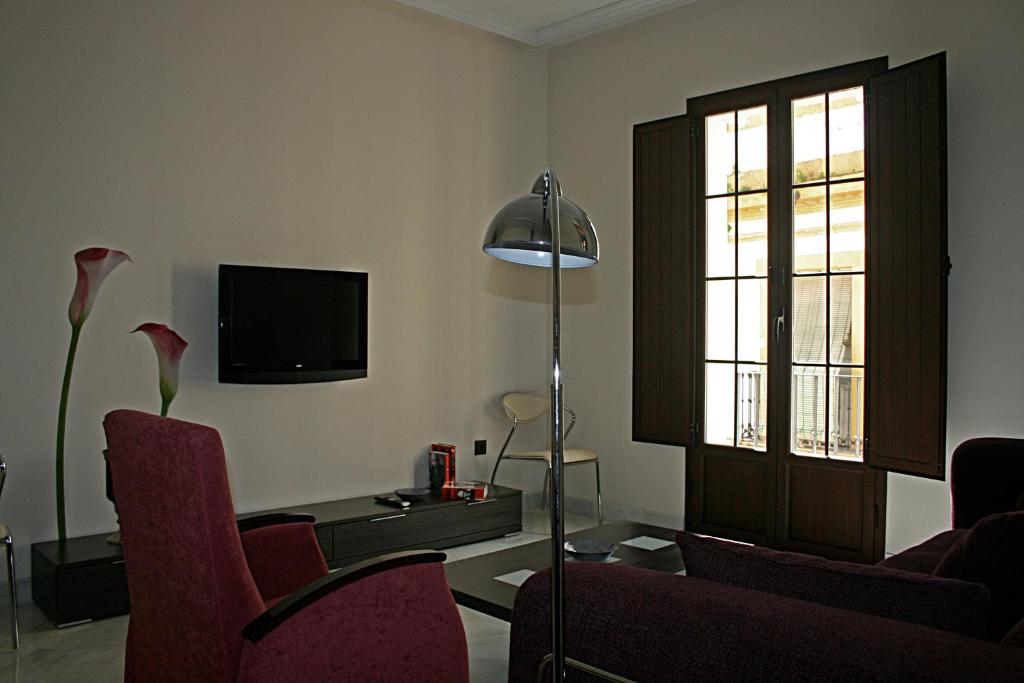 Televízia a/alebo spoločenská miestnosť v ubytovaní Living-Sevilla Apartments San Lorenzo