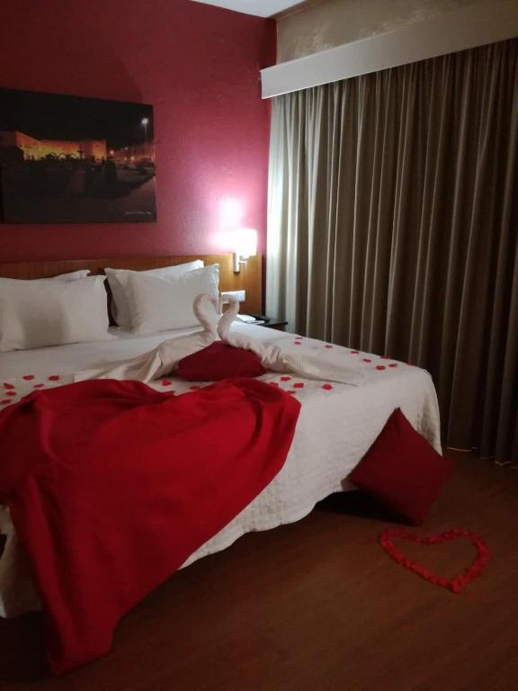 Postel nebo postele na pokoji v ubytování Hotel Dom Vilas