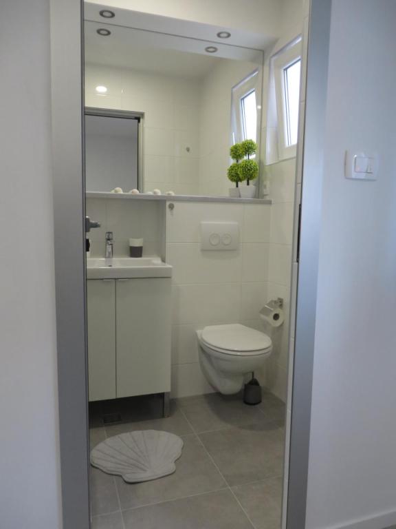 Kúpeľňa v ubytovaní Apartmani Raos