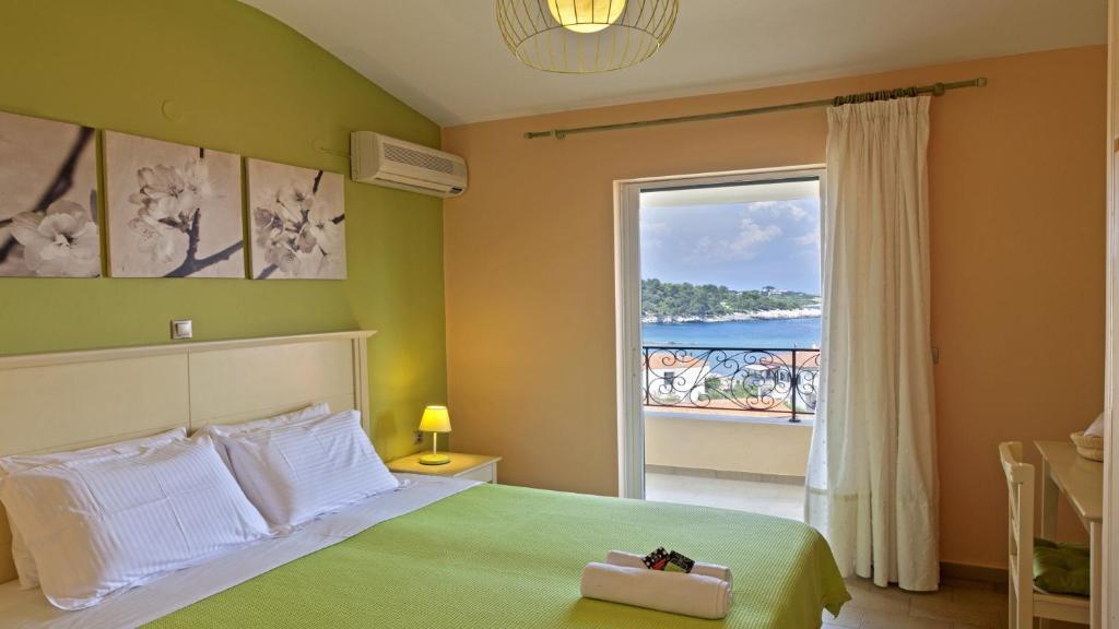 Postel nebo postele na pokoji v ubytování Elaia Boutique Apartments