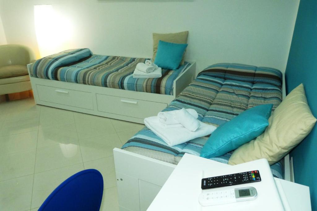 A bed or beds in a room at Casa Principe Maqueda