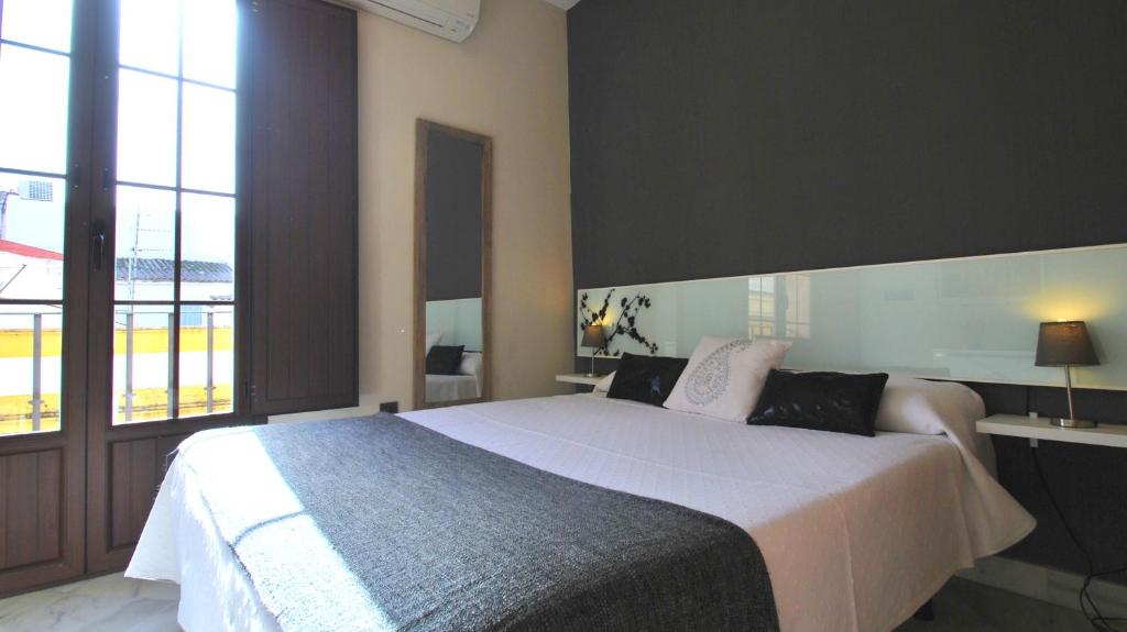 Posteľ alebo postele v izbe v ubytovaní Living-Sevilla Apartments San Lorenzo