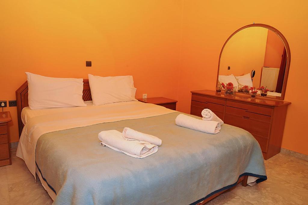 Postel nebo postele na pokoji v ubytování Hotel Pelagos Studios