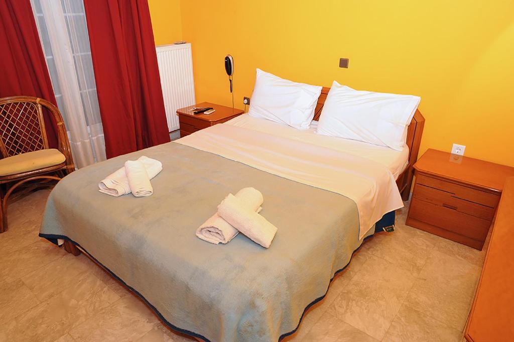 Postel nebo postele na pokoji v ubytování Hotel Pelagos Studios