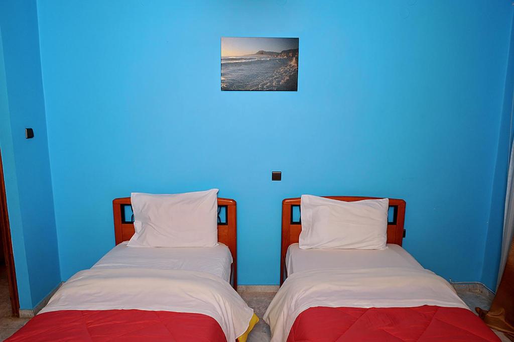 Postel nebo postele na pokoji v ubytování Hotel Pelagos Studios
