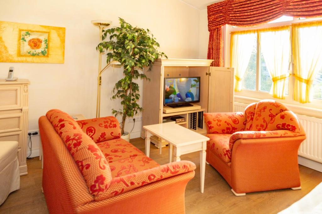 TV a/nebo společenská místnost v ubytování Apartments Wald-Residenz Bansin