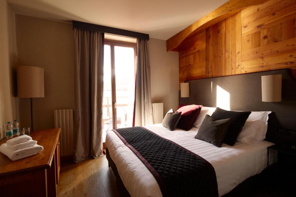 Postel nebo postele na pokoji v ubytování Chaberton Lodge & Spa