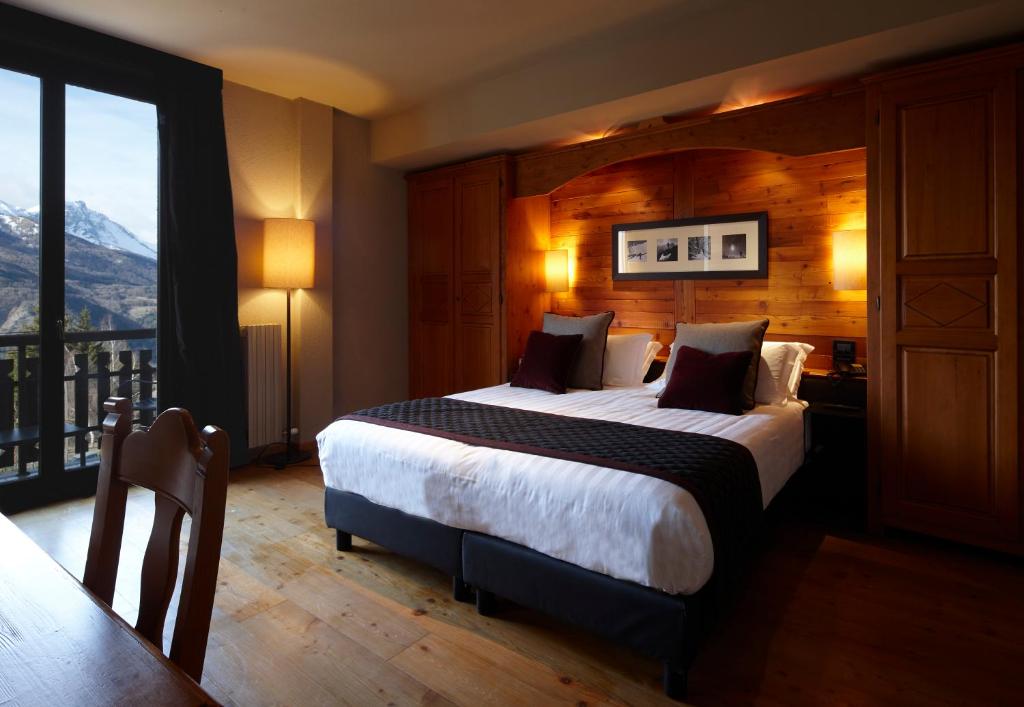Postel nebo postele na pokoji v ubytování Chaberton Lodge & Spa