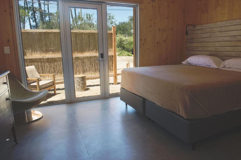 Postel nebo postele na pokoji v ubytování Wanderlust José Ignacio