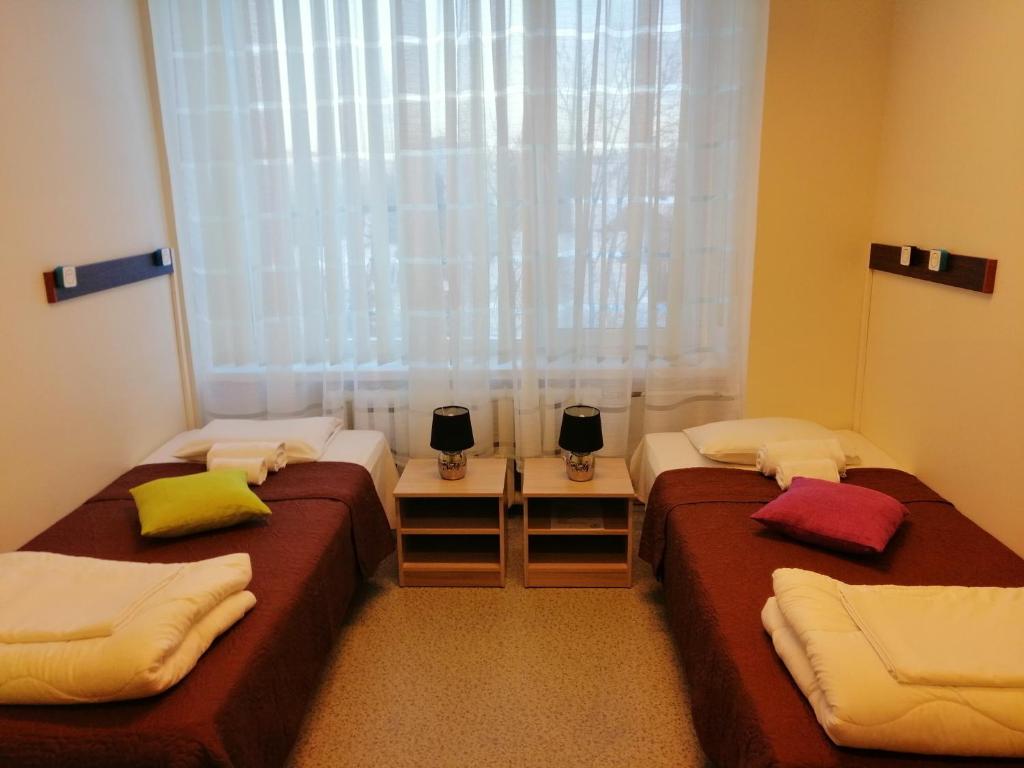 Postel nebo postele na pokoji v ubytování EHE Hostel