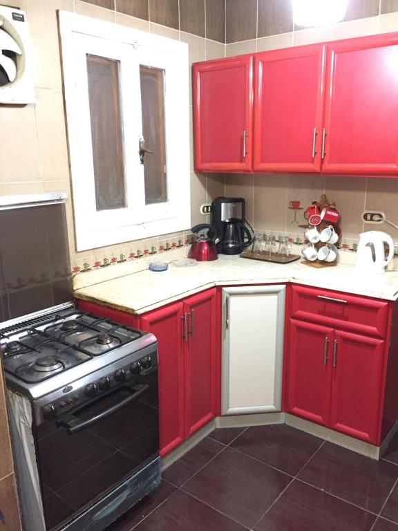 A kitchen or kitchenette at Maamoura Beach Zahraa Apartment 9/206
